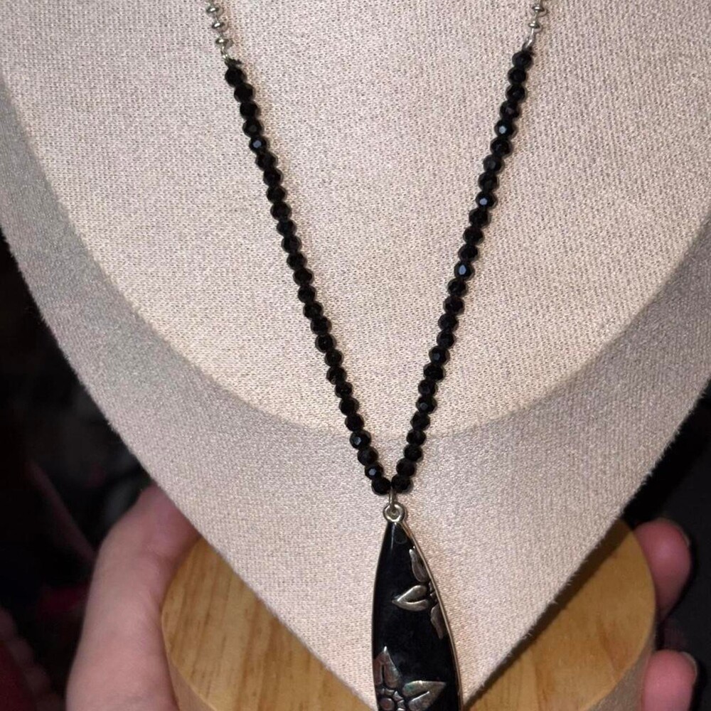 Liz Claiborne silver-tone and black flower pendant necklace.